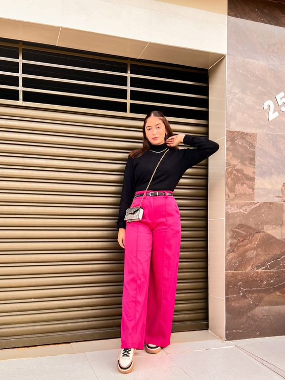 Keeping it sleek and simple with pink pants and black full-sleeves top!