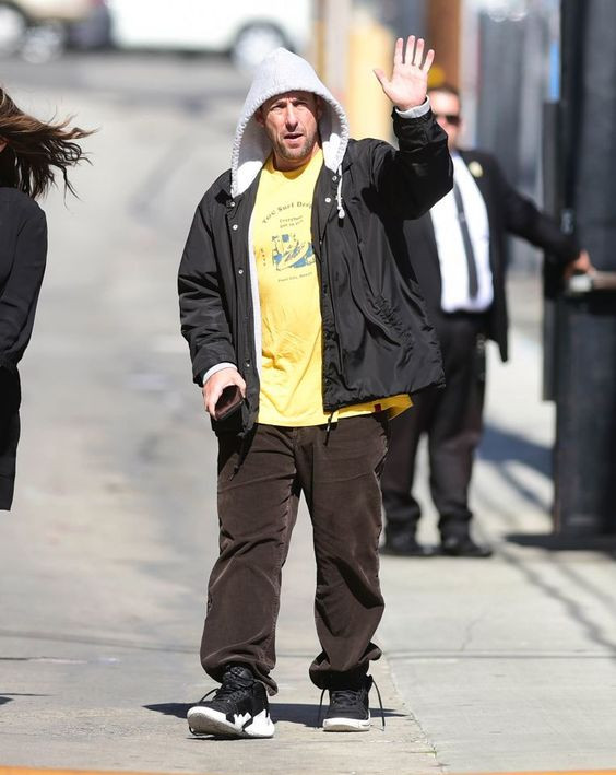 Wanna layer up like Sandler? Grab a yellow tee and throw on a hooded jacket!: Jennifer Aniston,  adam sandler  